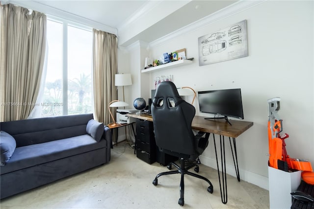 office area with crown molding, baseboards, and concrete flooring