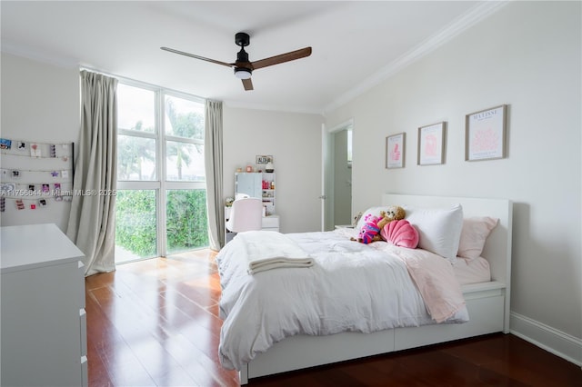 bedroom featuring floor to ceiling windows, crown molding, baseboards, and wood finished floors