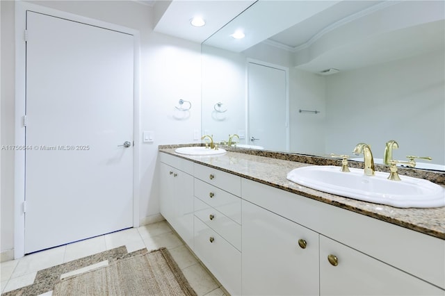 bathroom with double vanity, tile patterned floors, and a sink