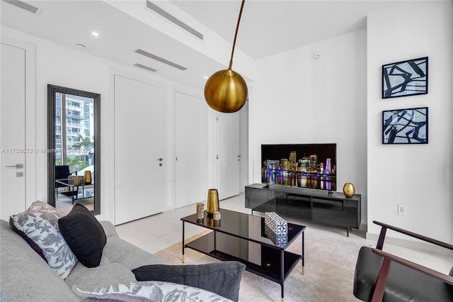 living room with recessed lighting and visible vents