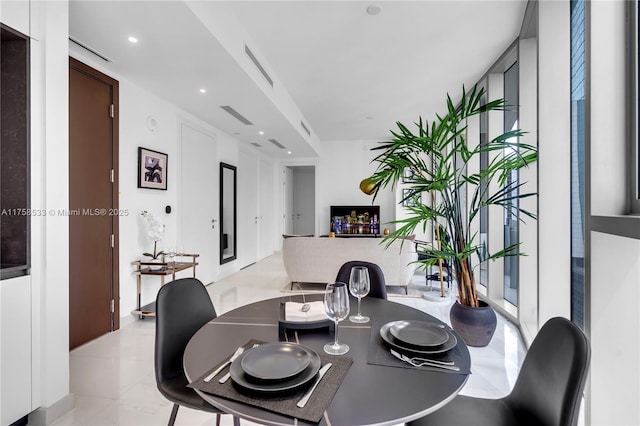 dining space with recessed lighting and visible vents