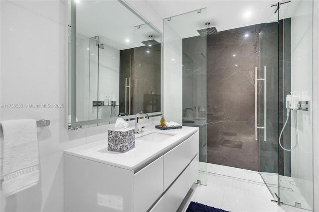 full bath with a shower stall and vanity