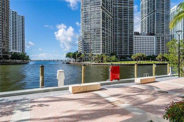 dock area with a water view and a city view