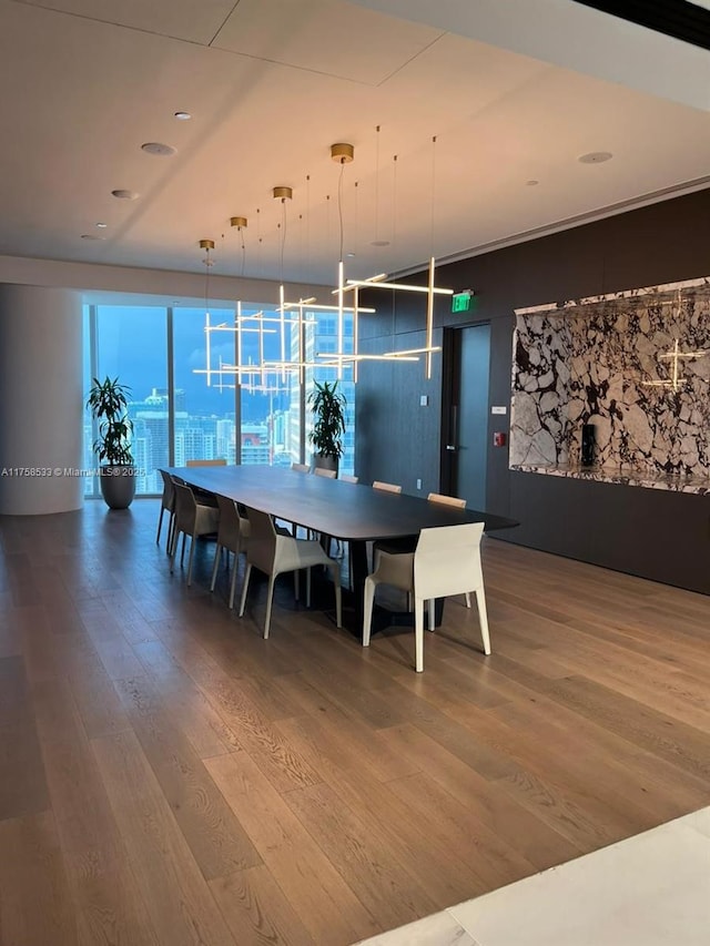 dining space with wood finished floors