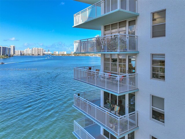 dock area with a water view and a city view