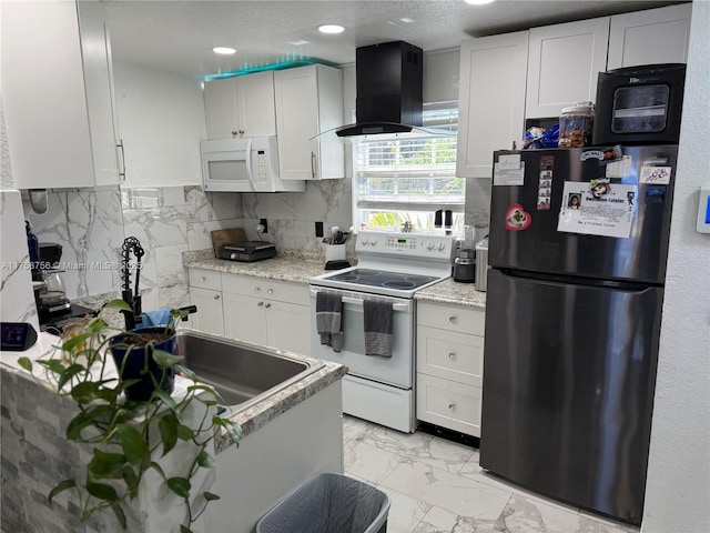 kitchen featuring white appliances, exhaust hood, white cabinetry, marble finish floor, and backsplash