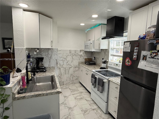 kitchen with white appliances, marble finish floor, ventilation hood, a textured ceiling, and a sink