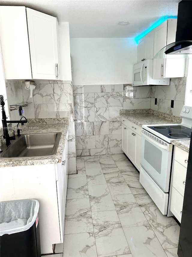 kitchen with a sink, light countertops, white appliances, marble finish floor, and extractor fan