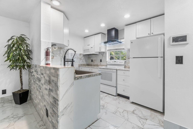 kitchen with wall chimney range hood, white cabinetry, white appliances, and marble finish floor