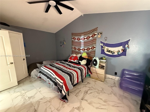 bedroom with lofted ceiling, marble finish floor, and ceiling fan