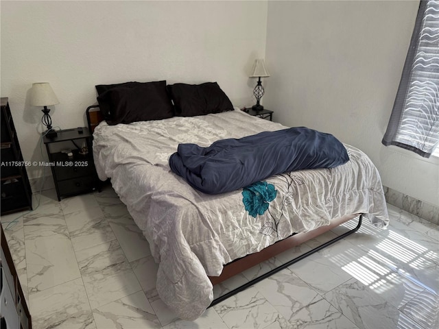 bedroom with marble finish floor