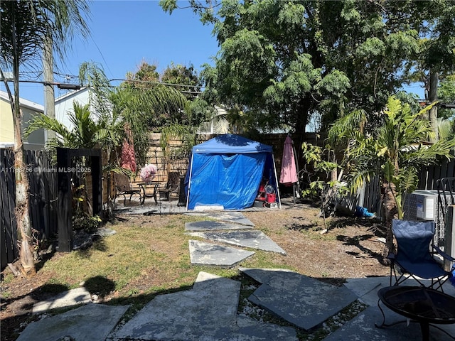 view of yard with a fenced backyard and a patio