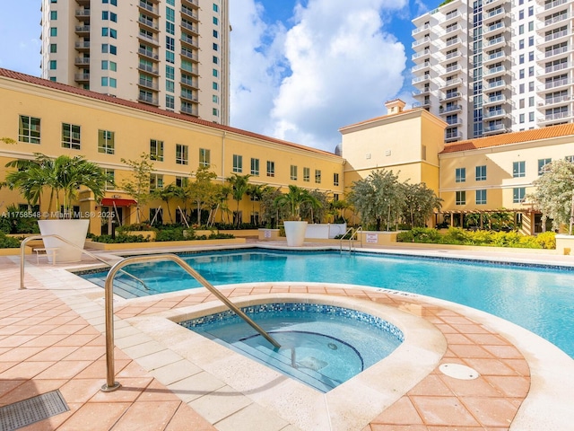 pool with a community hot tub