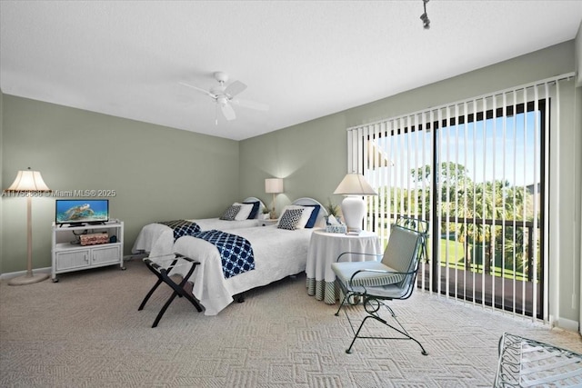 bedroom with a ceiling fan, carpet, access to outside, and baseboards