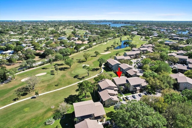 birds eye view of property with a residential view, a water view, and golf course view