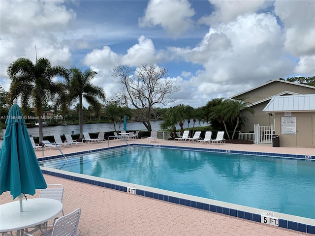 pool featuring a patio and fence