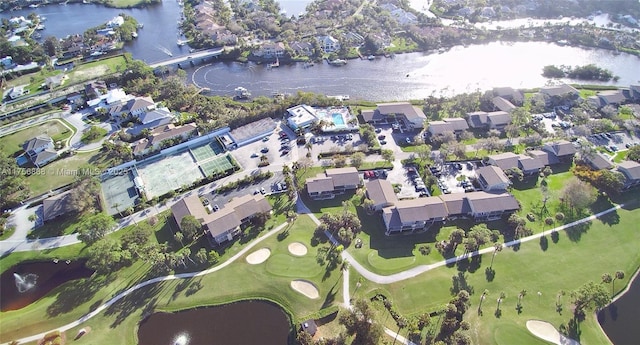 drone / aerial view featuring a water view and a residential view