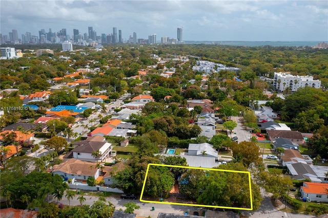 birds eye view of property with a view of city