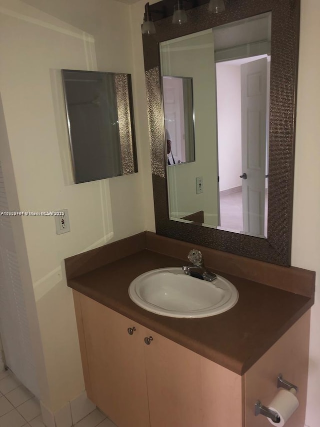 bathroom with vanity and tile patterned floors