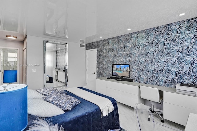 bedroom with marble finish floor, built in study area, visible vents, and recessed lighting