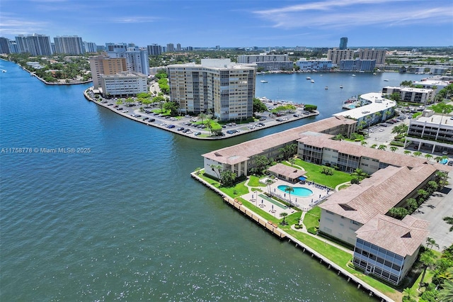 bird's eye view featuring a view of city and a water view