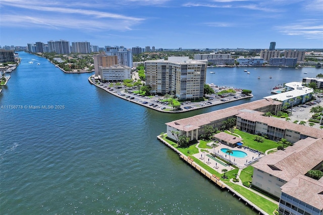 birds eye view of property featuring a view of city and a water view