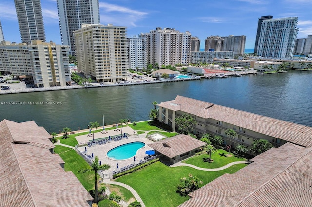 drone / aerial view featuring a view of city and a water view