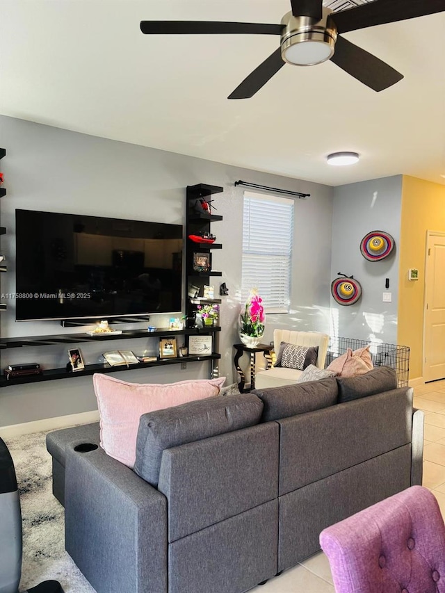 tiled living room featuring ceiling fan