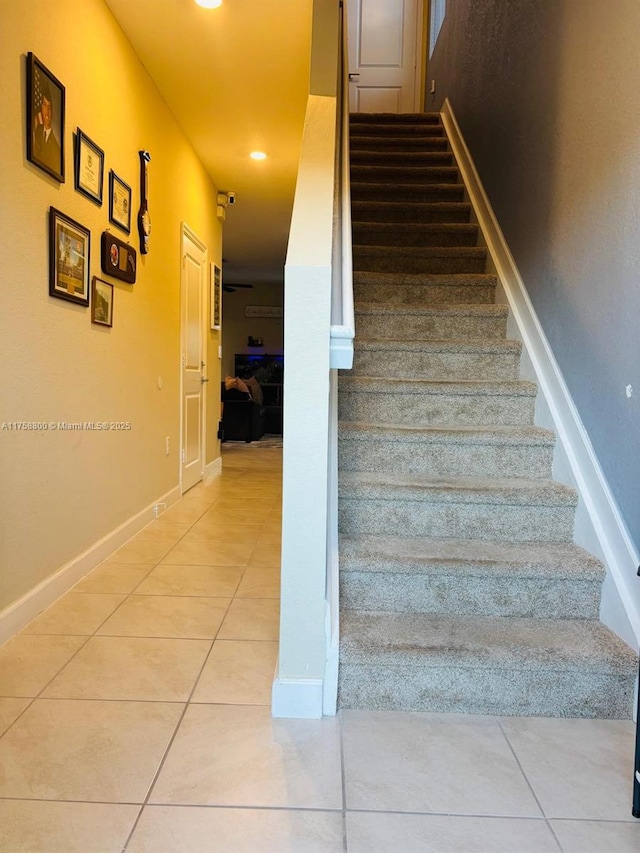 stairs with recessed lighting, baseboards, and tile patterned floors