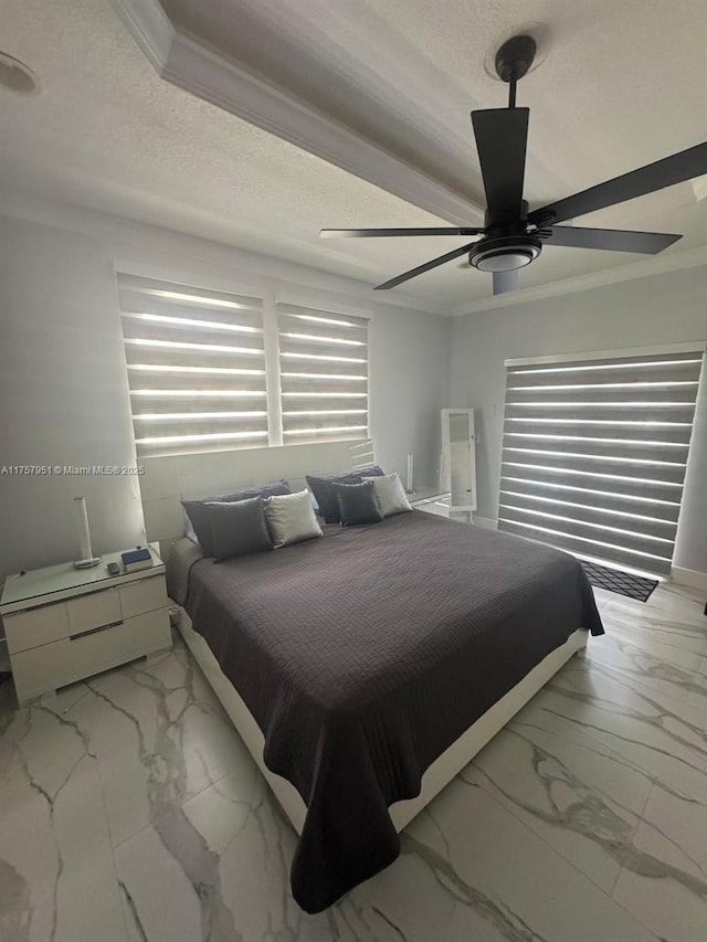 bedroom featuring light marble finish flooring, a textured ceiling, a ceiling fan, and ornamental molding
