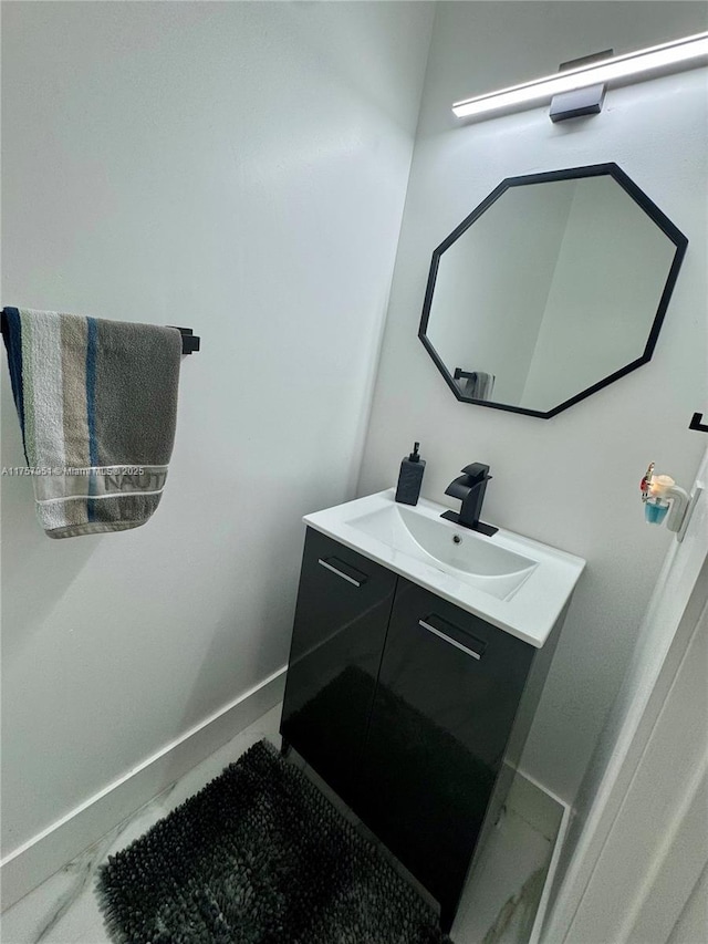 bathroom featuring vanity and baseboards