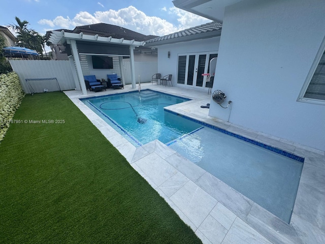 view of swimming pool featuring a patio area, a fenced in pool, french doors, and fence