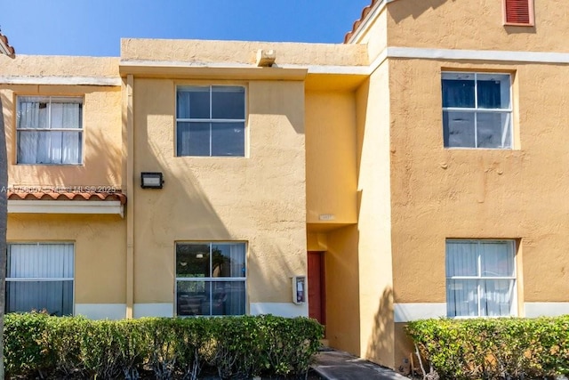 doorway to property with stucco siding