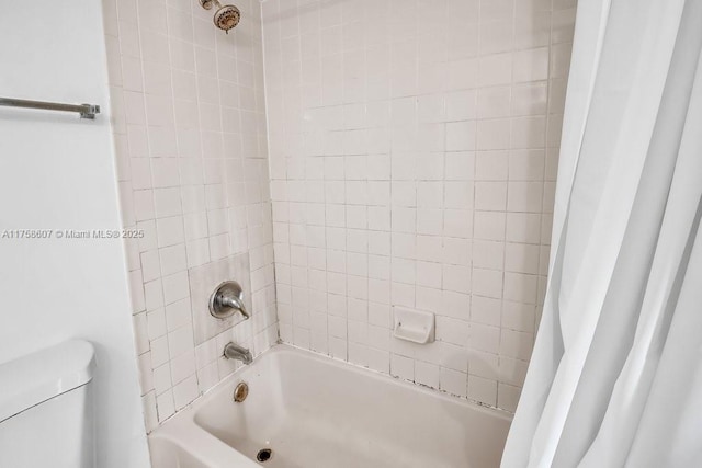 full bath featuring shower / bath combo and toilet