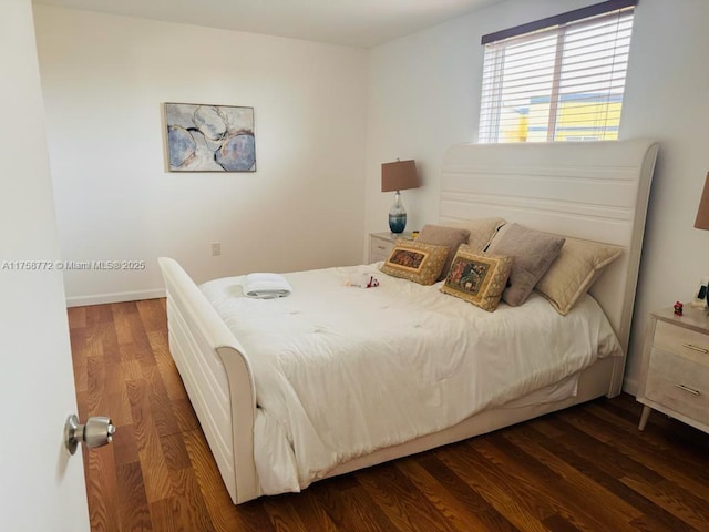 bedroom with wood finished floors