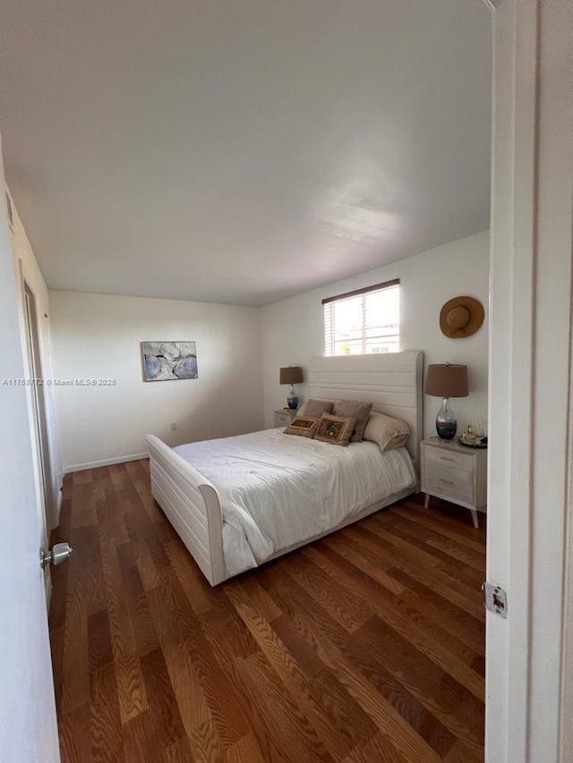 bedroom featuring wood finished floors