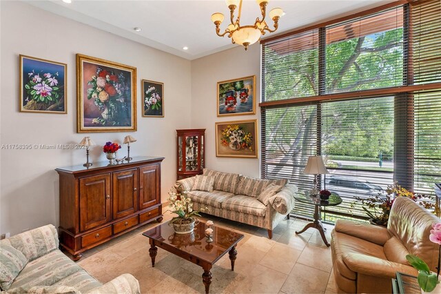 living area featuring an inviting chandelier, light tile patterned floors, a wealth of natural light, and recessed lighting