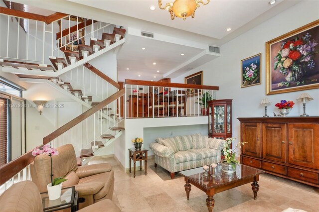 living area featuring stairs, visible vents, and recessed lighting