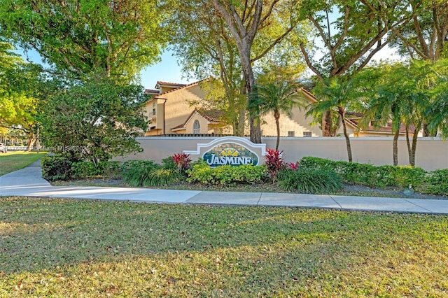 community / neighborhood sign with a lawn