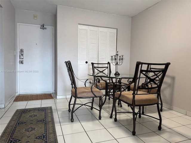 tiled dining room with baseboards