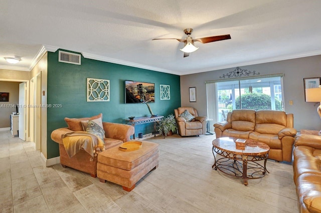 living area with ornamental molding, visible vents, baseboards, and a ceiling fan