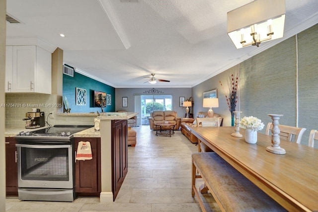 kitchen featuring ornamental molding, stainless steel electric range, white cabinetry, and light stone countertops