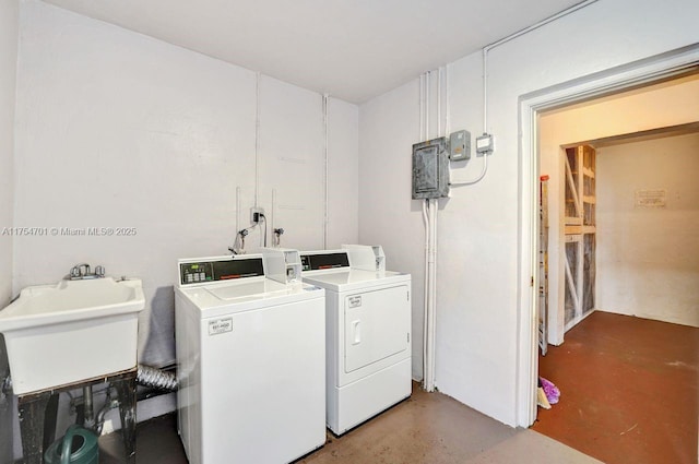 common laundry area featuring a sink and separate washer and dryer