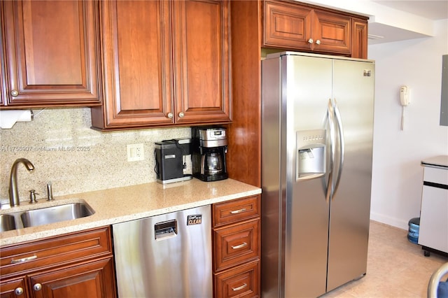 3970 Oaks Clubhouse Dr Unit 307, Pompano Beach, FL 33069 - kitchen with stainless steel appliances, a sink, tasteful backsplash, light stone counters, and baseboards