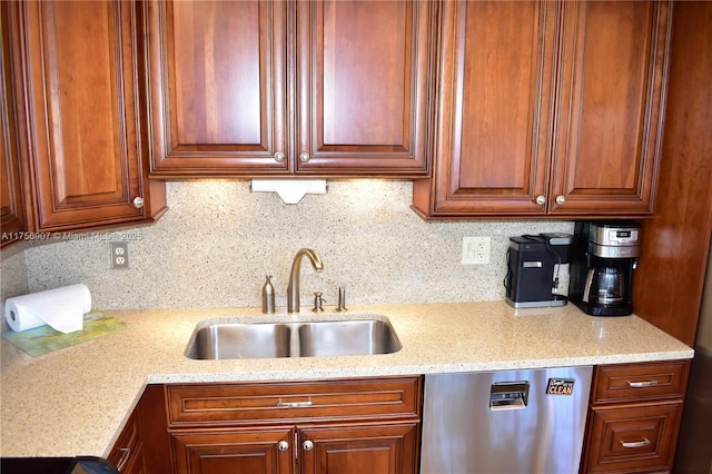 3970 Oaks Clubhouse Dr Unit 307, Pompano Beach, FL 33069 - kitchen featuring stainless steel dishwasher, a sink, decorative backsplash, light stone counters, and brown cabinetry