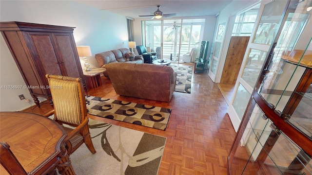 3970 Oaks Clubhouse Dr Unit 307, Pompano Beach, FL 33069 - living room featuring a ceiling fan and baseboards