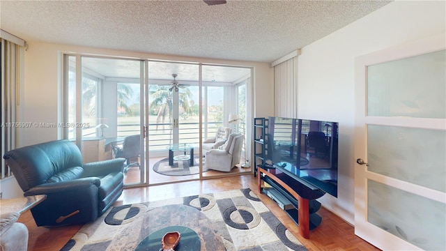 3970 Oaks Clubhouse Dr Unit 307, Pompano Beach, FL 33069 - living room with a textured ceiling