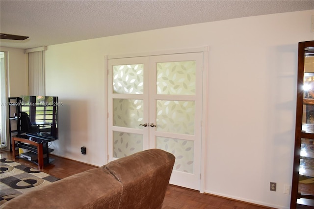 3970 Oaks Clubhouse Dr Unit 307, Pompano Beach, FL 33069 - living room featuring a textured ceiling