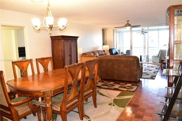 3970 Oaks Clubhouse Dr Unit 307, Pompano Beach, FL 33069 - dining room with a ceiling fan, a chandelier, a textured ceiling, and floor to ceiling windows