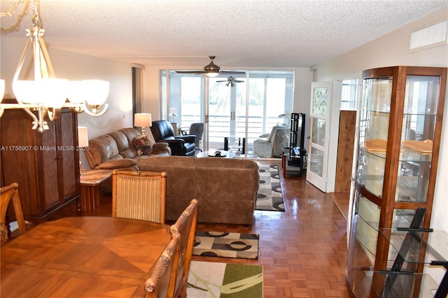 3970 Oaks Clubhouse Dr Unit 307, Pompano Beach, FL 33069 - dining room featuring a textured ceiling, french doors, a chandelier, and ceiling fan